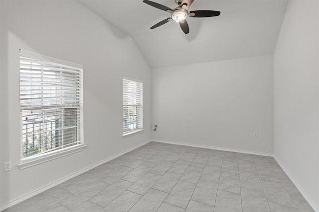 unfurnished room featuring a ceiling fan, lofted ceiling, and baseboards