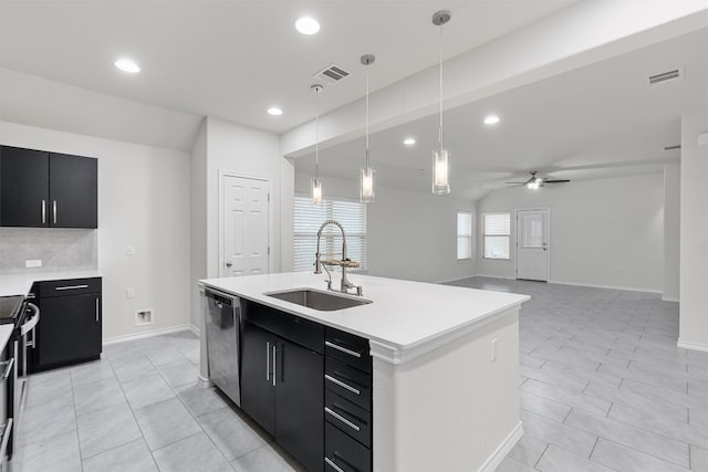 kitchen with visible vents, dishwasher, dark cabinets, light countertops, and a sink