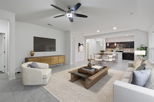 living room featuring recessed lighting, visible vents, a ceiling fan, light tile patterned flooring, and baseboards