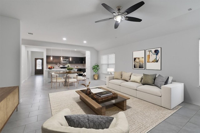 living room with a ceiling fan, recessed lighting, visible vents, and light tile patterned flooring