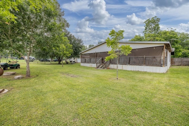 view of yard with a sunroom