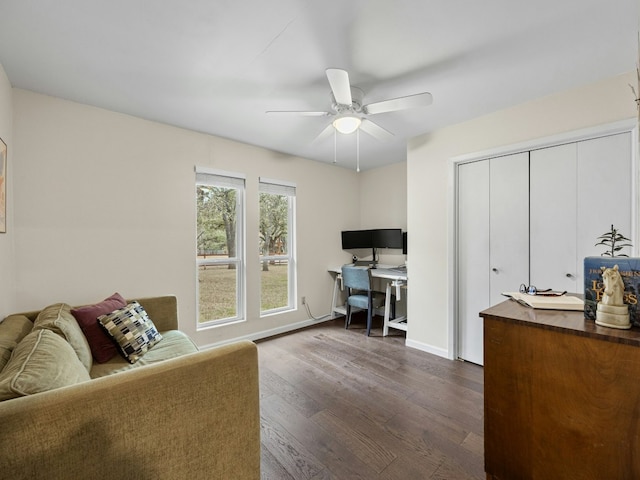 office featuring dark wood-style floors, baseboards, and a ceiling fan