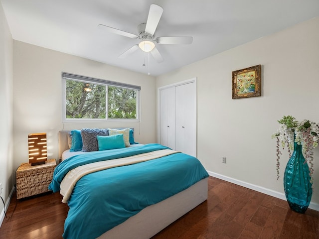 bedroom with ceiling fan, a closet, baseboards, and wood finished floors