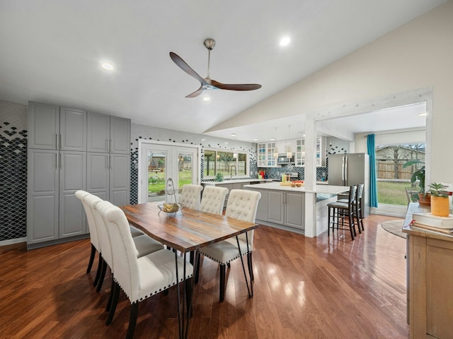 dining space with french doors, recessed lighting, a ceiling fan, vaulted ceiling, and wood finished floors