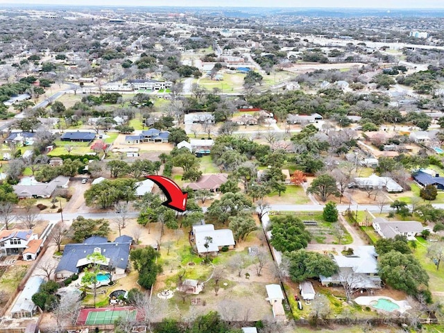 birds eye view of property with a residential view