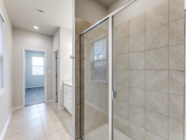 full bath with a shower stall, vanity, visible vents, and tile patterned floors