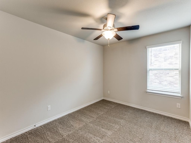 unfurnished room with carpet, baseboards, and ceiling fan