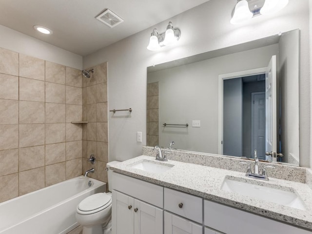 full bath with toilet,  shower combination, a sink, and visible vents