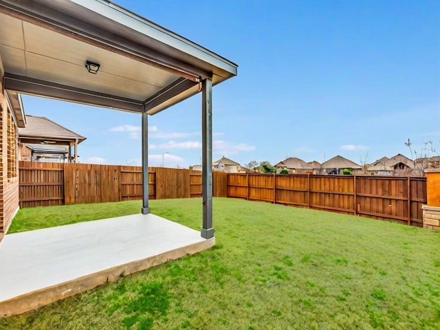 view of yard featuring a patio area and a fenced backyard