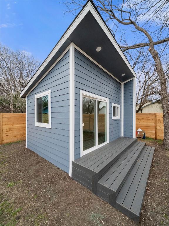 view of outdoor structure featuring a fenced backyard