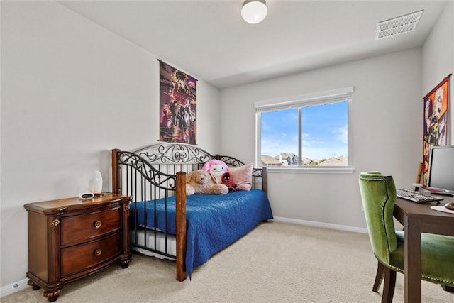 bedroom with carpet floors, visible vents, and baseboards