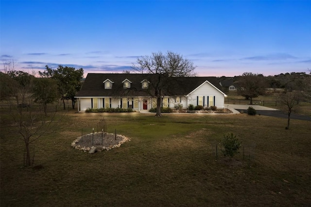 view of front of property with a lawn