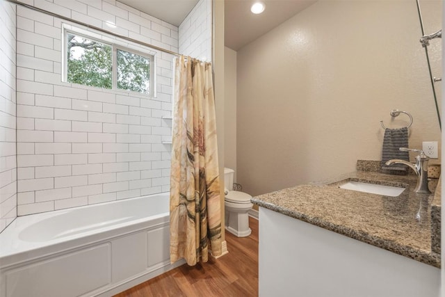 full bathroom with vanity, shower / bath combo, wood finished floors, and toilet