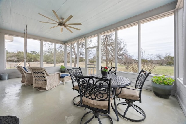 sunroom with a ceiling fan