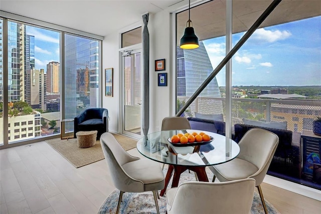 sunroom / solarium with a city view