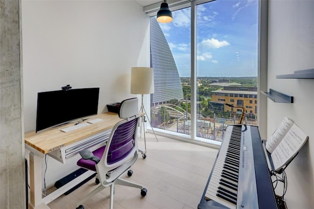 office area with wood finished floors and floor to ceiling windows