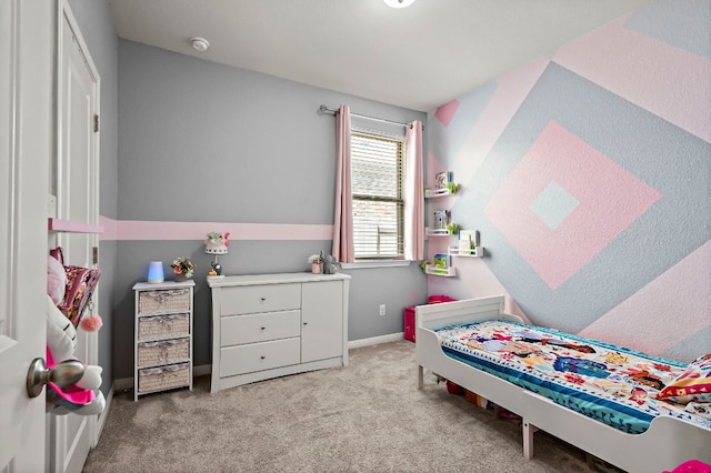 bedroom with carpet and baseboards