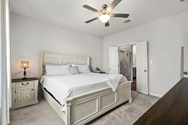 bedroom featuring baseboards, visible vents, a ceiling fan, and light colored carpet