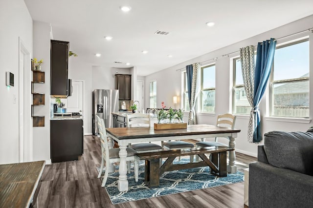 dining space with dark wood-style floors, recessed lighting, and visible vents