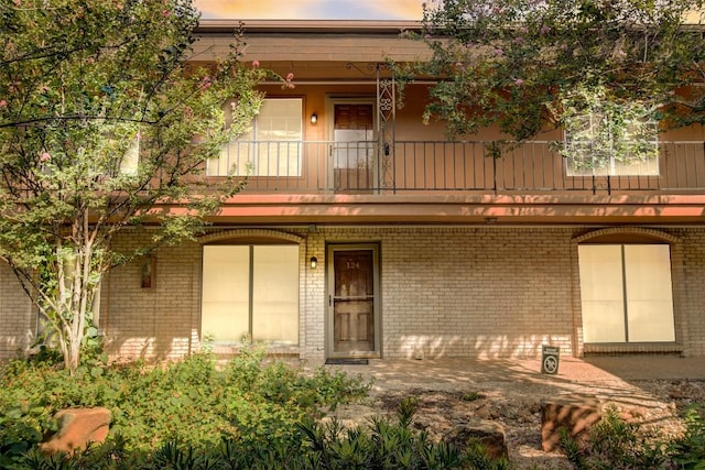 7801 Shoal Creek Blvd Unit 224, Austin, TX 78757 - exterior space with brick siding and a balcony