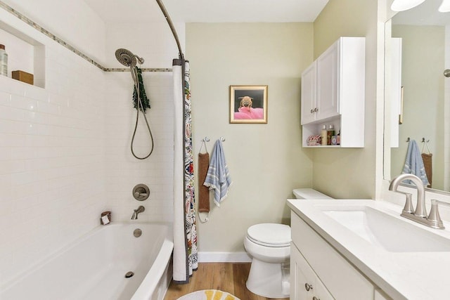 bathroom with shower / bath combination with curtain, toilet, vanity, wood finished floors, and baseboards