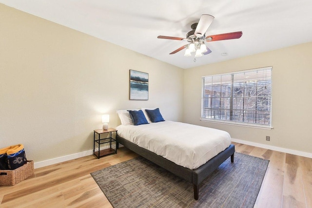 7801 Shoal Creek Blvd Unit 224, Austin, TX 78757 - bedroom with wood finished floors, ceiling fan, and baseboards