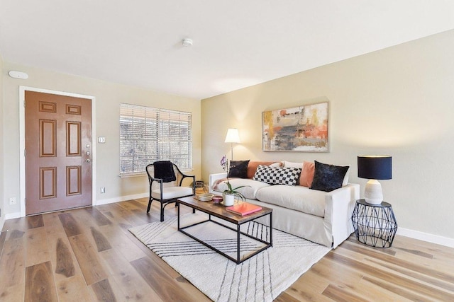 living room with wood finished floors and baseboards