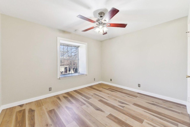 unfurnished room with light wood-type flooring, ceiling fan, and baseboards