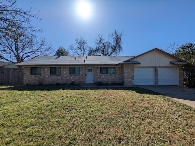 ranch-style house featuring brick siding, fence, a garage, driveway, and a front lawn