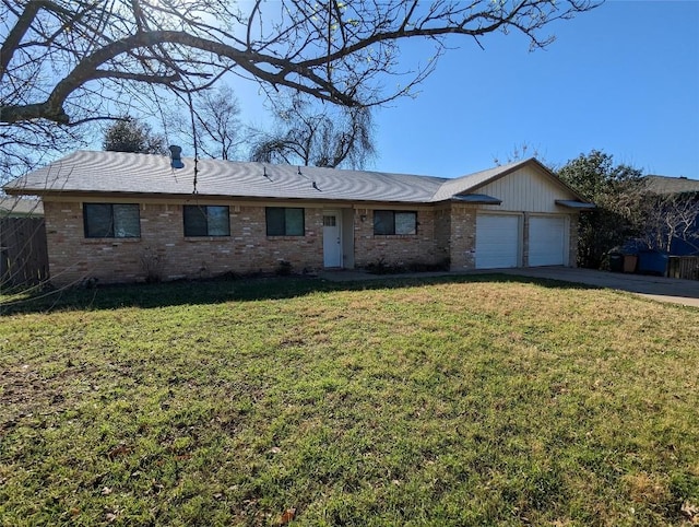 ranch-style home with an attached garage, brick siding, concrete driveway, and a front yard