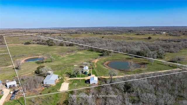 aerial view with a rural view and a water view