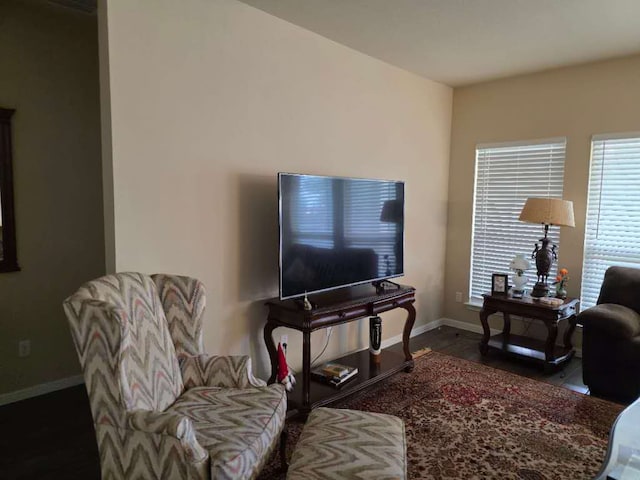 living area featuring baseboards