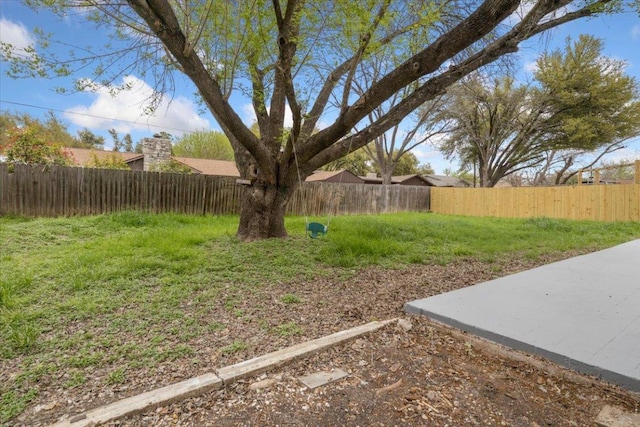 view of yard with a fenced backyard