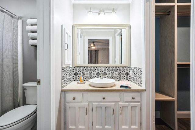 full bath featuring backsplash, toilet, and vanity