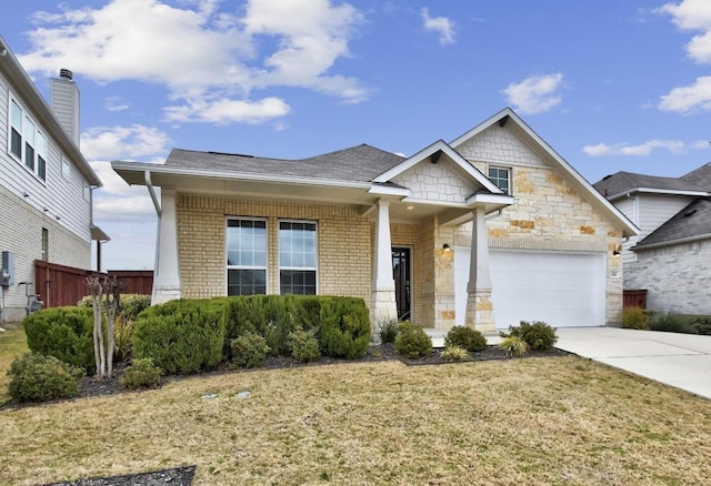 craftsman inspired home featuring stone siding, concrete driveway, a front yard, a garage, and brick siding