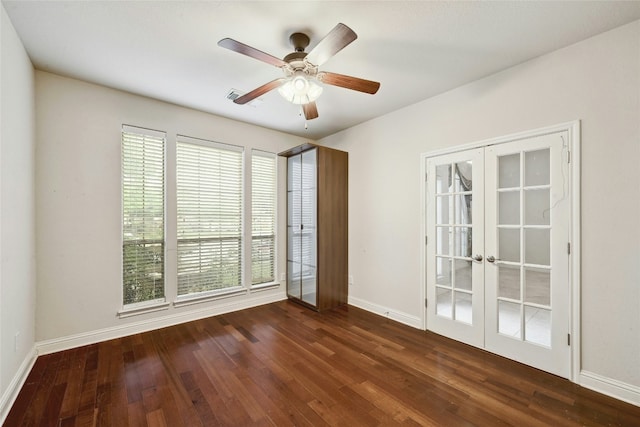 spare room with ceiling fan, french doors, wood finished floors, and baseboards