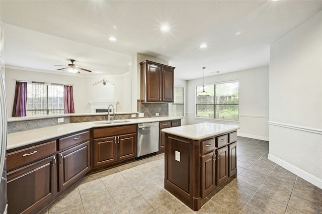 kitchen featuring a sink, light countertops, dark brown cabinets, decorative backsplash, and dishwasher