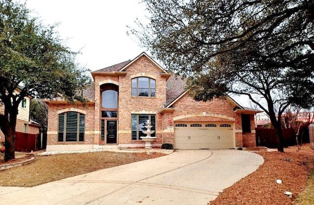 2989 Agave Loop, Round Rock, TX 78681 - traditional-style home featuring brick siding, an attached garage, and concrete driveway