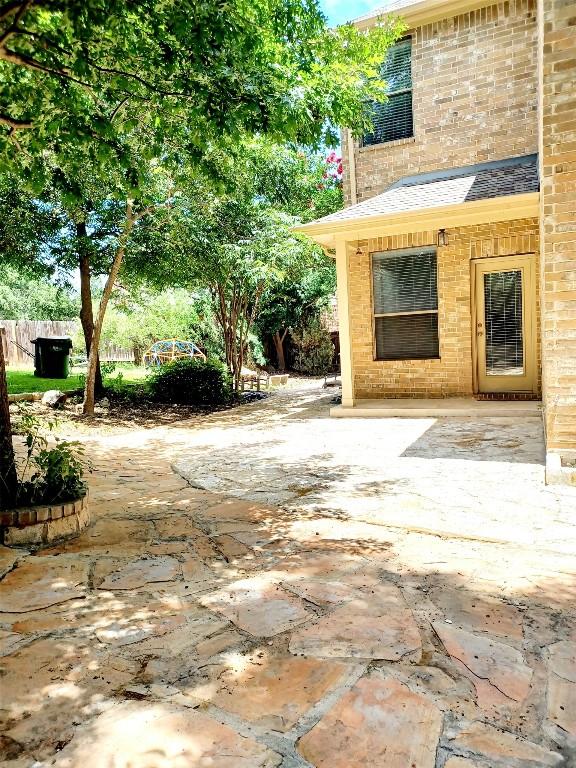 view of patio featuring fence