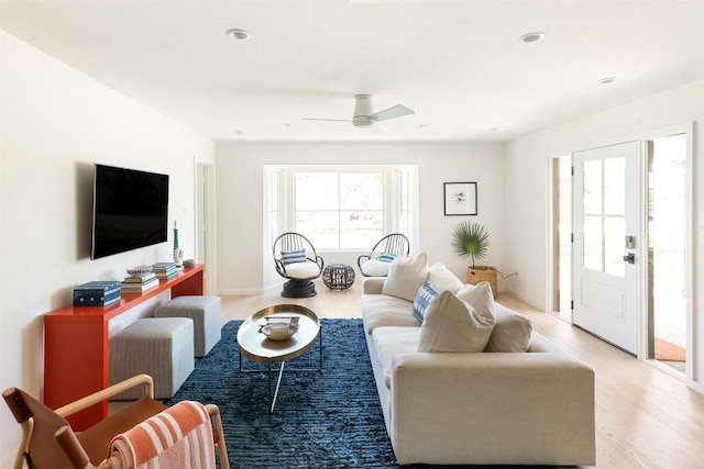 living room featuring light wood-type flooring, plenty of natural light, recessed lighting, and ceiling fan