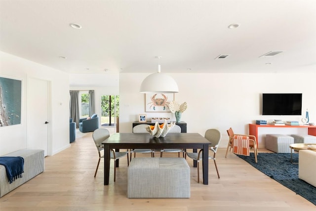 dining room featuring light wood-type flooring, visible vents, and recessed lighting