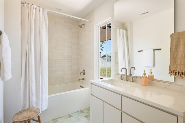 full bathroom featuring shower / tub combo, vanity, and visible vents