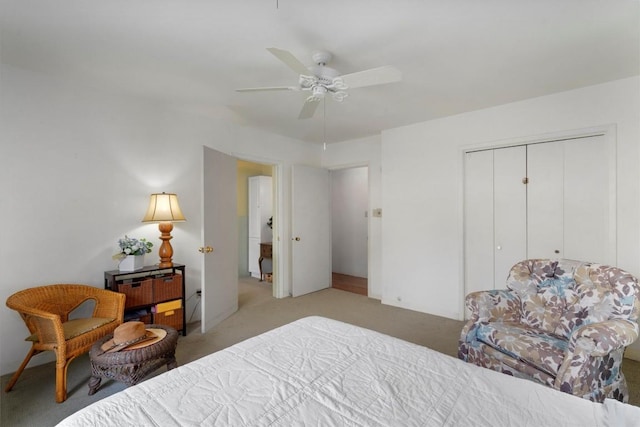 carpeted bedroom with a ceiling fan and a closet