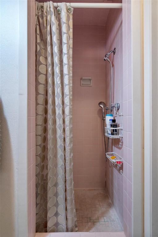 full bathroom with a tile shower