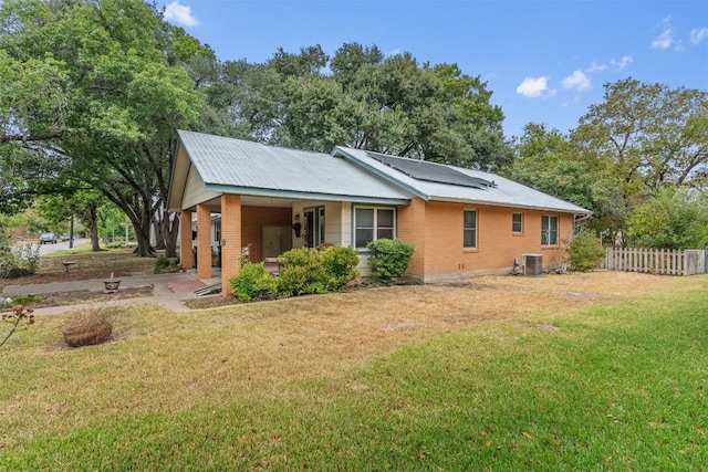 1805 Eubank St, Georgetown, TX 78626 - rear view of house with brick siding and roof mounted solar panels