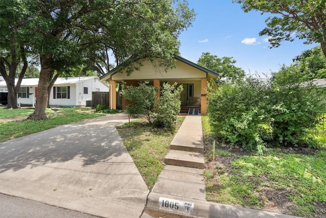 1805 Eubank St, Georgetown, TX 78626 - view of front facade featuring concrete driveway, a porch, and brick siding