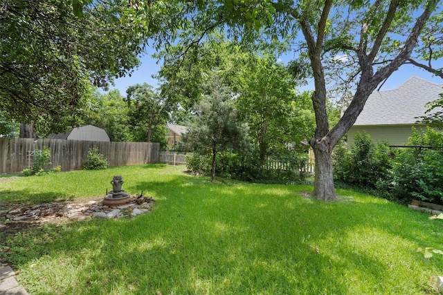 view of yard with a fenced backyard