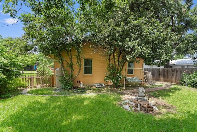 view of yard featuring fence