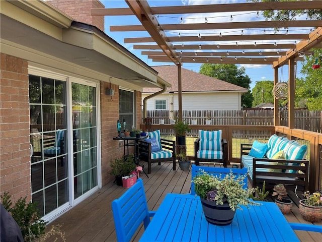 deck with fence, an outdoor hangout area, and a pergola