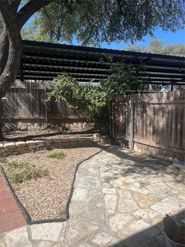 view of patio / terrace featuring fence